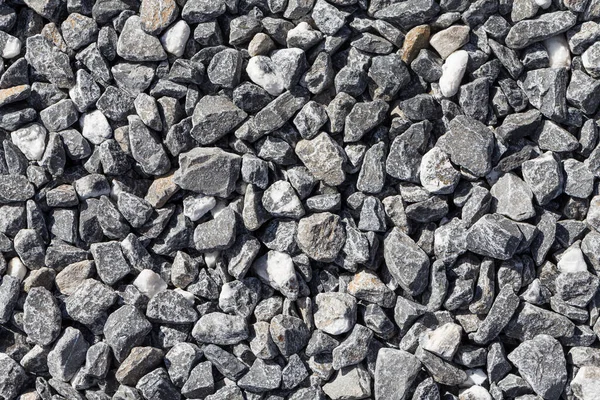 地面のテクスチャ背景に灰色砕石 — ストック写真