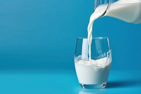 3d rendering, pouring milk in glass, isolated on blue background.