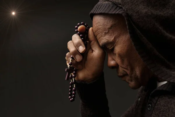 praying to god for forgiveness Caribbean man praying  with people stock image stock photo