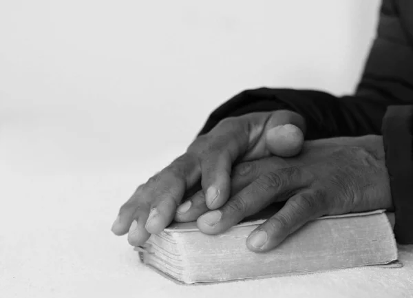 black man people praying to God with hands