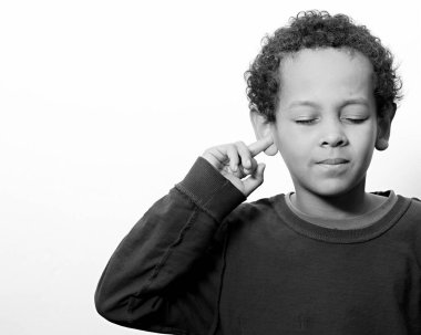 little deaf boy covering his ears on white background clipart