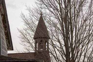 church with cross on the roof of the house