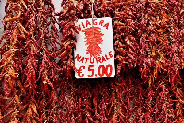 Red chillies on strings, natural Viagra, Amalfi, Campania, Italy, Europe