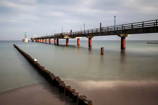 stock image Groynes, wooden stages and pier with diving gondola, long time exposure, Zingst, Fischland-Dar-Zingst, Western Pomerania Lagoon Area National Park, Mecklenburg-Western Pomerania, Germany, Europe 