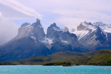Cuernos del Paine massif with clouds on Lake Peho, Torres del Paine National Park, ltima Esperanza Province, Chile, South America  clipart
