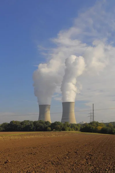Nuclear power plant. Grafenrheinfeld nuclear power plant near Schweinfurt, cooling tower with steam cloud