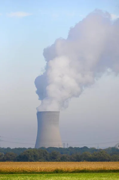 Nuclear power plant. Grafenrheinfeld nuclear power plant near Schweinfurt, cooling tower with steam cloud