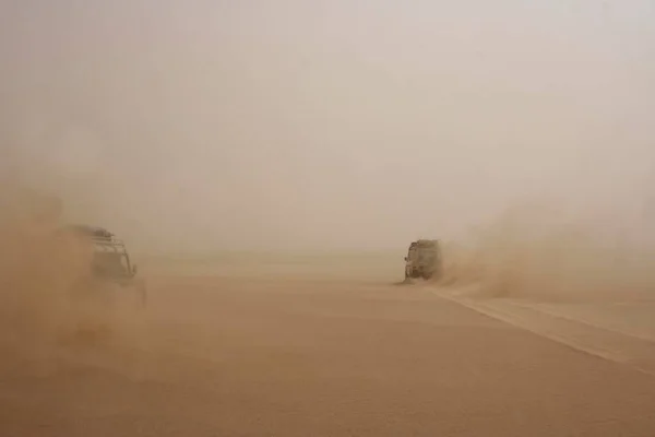 Threatening driving conditions in the sandy desert caused by poor visibility near Wau en Namus, Libya, Africa