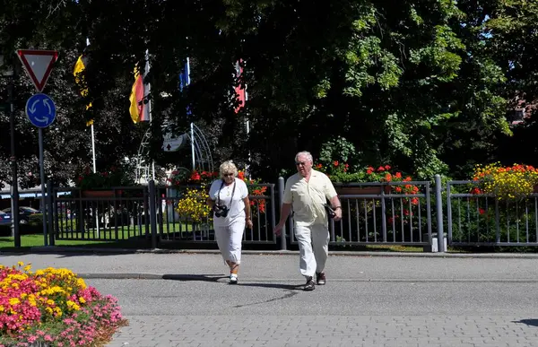 stock image Elderly couple walking on a street