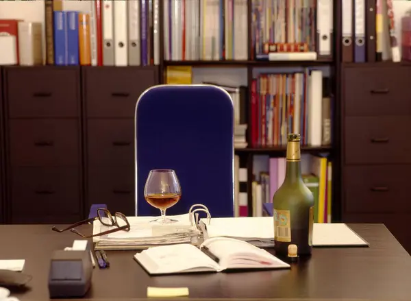 Alcohol in the workplace, office scene, alcohol in the office