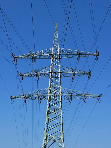 Power pylons in the field, power lines, overhead power line, supply lines, electrosmog, environmental pollution, high voltage, power pylons, energy suppliers, EnBW, Vattenfall, Eon, RWE