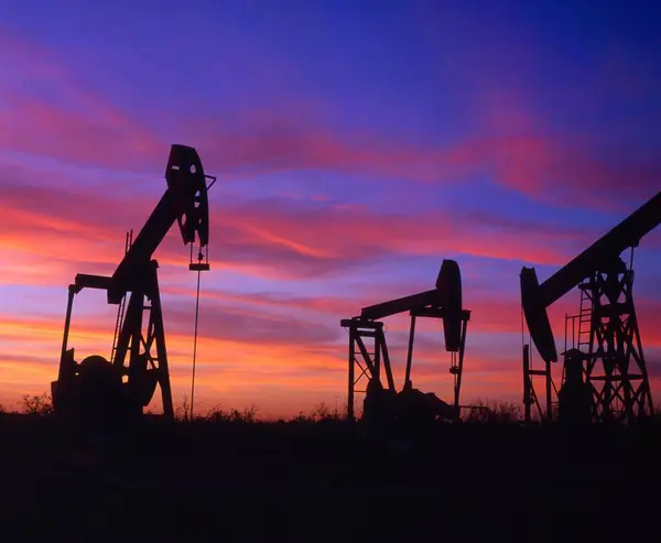 Crude oil production, deep pumps at sunset, Texas oil fields, Petroleum Museum, Midland-Odessa, USA