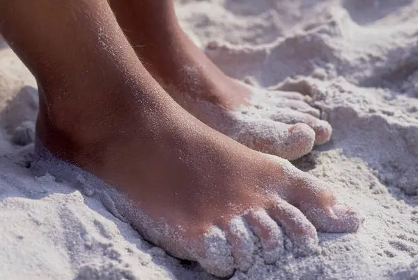 Feet in the sand, children's feet
