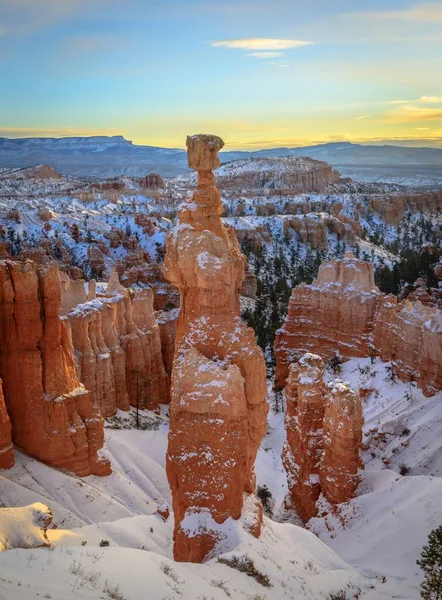 Rock formation Thors Hammer, morning light, bizarre snowy rock landscape with Hoodoos in winter, Navajo Loop Trail, Bryce Canyon National Park, Utah, USA, North America