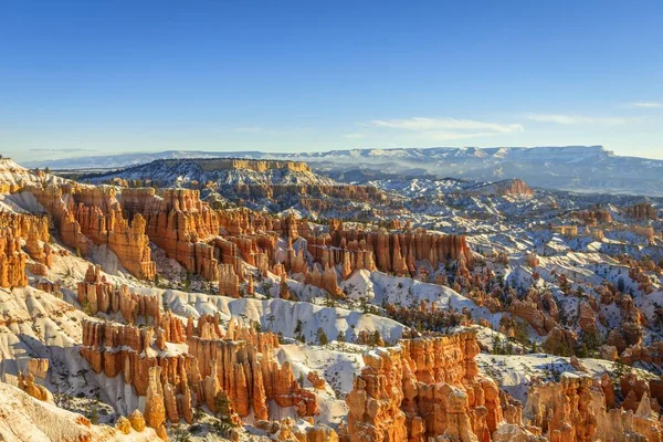 Morning light, snow-covered bizarre rocky landscape with Hoodoos in winter, Sunset Point, Bryce Canyon National Park, Utah, USA, North America