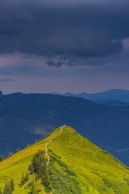 Upcoming thunderstorm over Kuhgehrenspitze, 1910m, Allgaeuer Alps, Kleinwalsertal, Vorarlberg, Austria, Europe clipart