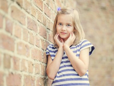 Girl, 10 years, leaning against a wall, Portrait, Germany, Europe clipart