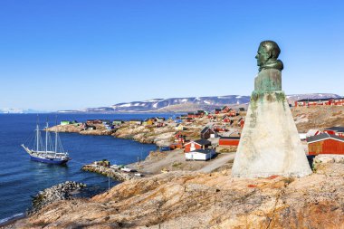 East Greenland town Ittoqqortoormiit with view to the harbour and the statue of Einar Mikkelsen, Scoresbysund, East Greenland, Greenland, North America clipart