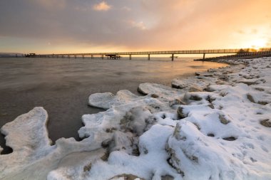 Sunrise with ice and snow on the shore of Lake Constance, Altnau, Thurgau, Switzerland, Europe clipart