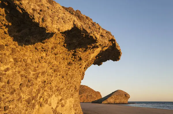 stock image Fossilized lava tongues and walls at the beach Playa del Monsul, Nature Reserve Cabo de Gata-Nijar, Almeria province, Andalusia, Spain, Europe