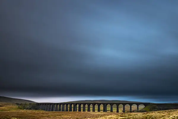 stock image Railway bridge, Ribblehead viaduct in autumn landscape with dramatic cloud sky, Ingelton, Yorkshire Dales National Park, Midlands, Great Britain