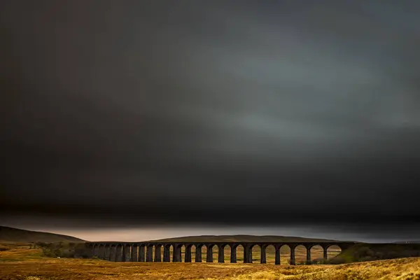 stock image Railway bridge, Ribblehead viaduct in autumn landscape with dramatic cloud sky, Ingelton, Yorkshire Dales National Park, Midlands, Great Britain