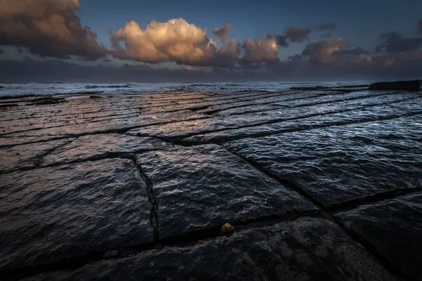 stock image Coast with granite rocks washed by the sea in the evening light, Berwick up on Tweed, Northumberland, Great Britain