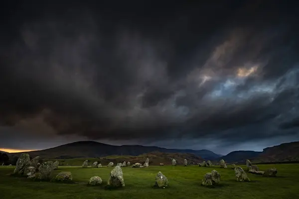 stock image Stone circle with dramatic dark cloud sky, Keswick, Yorkshire Dales National Park, Central England, Great Britain