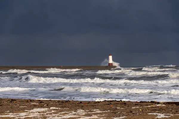 stock image Berwick Lighthouse with strong surf and dark cloudy sky, Berwick-upon-Tweed, Newcastle upon Tyne, Northumberland, Great Britain