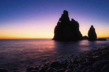 Volcanic rock formation Ilheus da Rib, steep coast of Ribeira de Janela, also Ribeira da Janela, sunrise, Porto Moniz, island Madeira, Portugal, Europe clipart