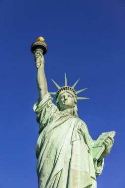 Statue of Liberty in front of blue sky, Liberty Island, Statue of Liberty National Monument, New York City, New York, USA, North America clipart