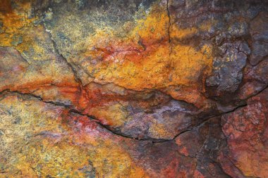 Colourful rust on a ferrous rock, Iceland, Europe clipart