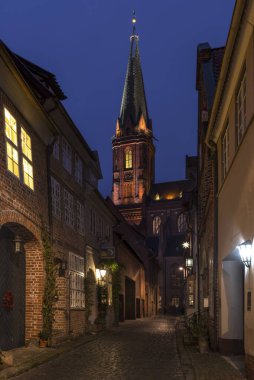 Coloured illuminated St. Nicholas Church at Christmas time, Lneburg, Lower Saxony, Germany, Europe  clipart