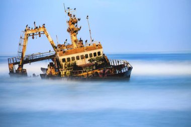 Shipwreck Zeila in the water with swell, Henties Bay, Erongo region, Namibia, Africa clipart