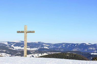 Summit cross of the Belchen in winter with snow, on the horizon the Feldberg, Black Forest, Baden-Wrttemberg, Germany, Europe  clipart