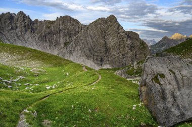 Mountain path with Guffelspitze and Lechtaler Alps in the morning light Gramais, Lechtal Auerfern, Tyrol, Austria, Europe  clipart