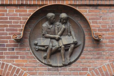 Relief with two school children at the former elementary school, built 1936, Travemnde, Schleswig-Holstein, Germany, Europe  clipart