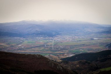 View from the track route to Viden peak, Konyavska mountain, Kyustendil, Bulgaria clipart