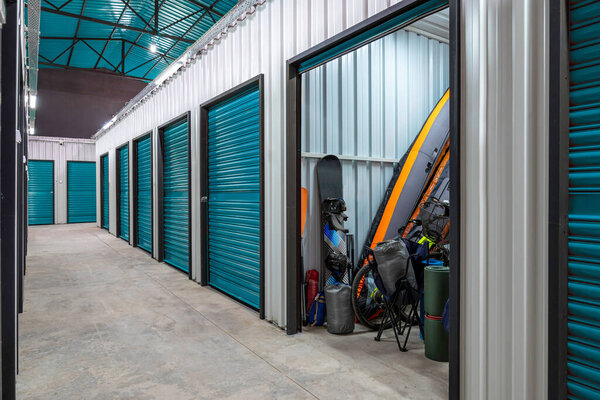 Outdoors activity items seen through the open door of the self storage unit. Rental Storage Units