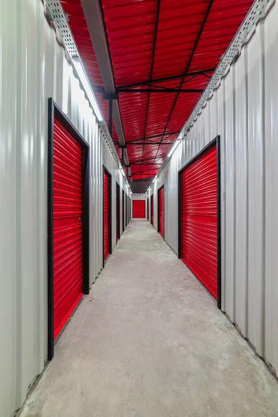 stock image Corridor of self storage unit with red doors. Rental Storage Units