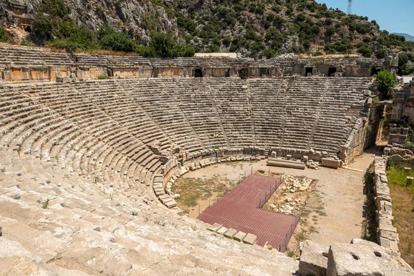 stock image The ruins of the amphitheater and ancient rock tombs in the ancient city of Myra in Demre, Turkey