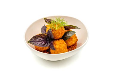 Homemade Fried Sicilian Arancini stuffed with meat, with tomato sauce