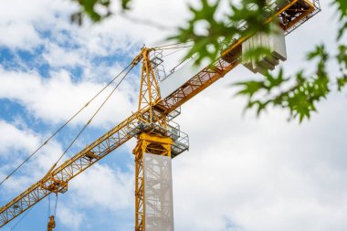 Construction crane working on large construction site