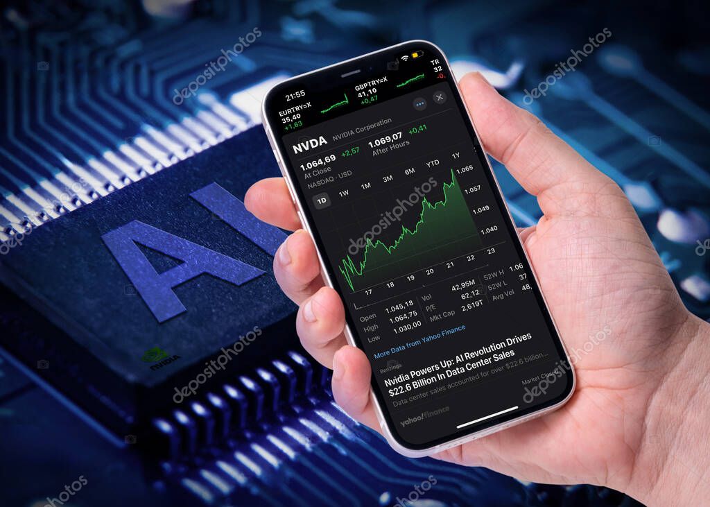 Antalya, Turkey - May 26, 2024: NVIDIA's stock prices on the iPhone screen and the AI with the nvidia logo on the computer processor behind it