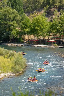 Antalya, Turkey - June 27, 2024: Rafting on a big rafting boat on the river in Antalya Koprulu Canyon. clipart