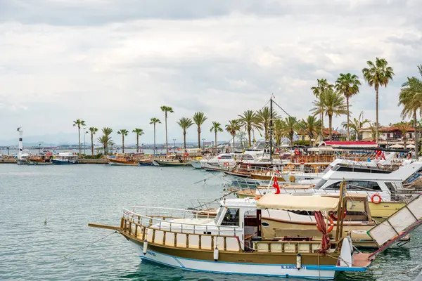 stock image Side, Manavgat, Turkey - April 9, 2024: Sightseeing boats and town square in Side, one of Turkey's unique and historical holiday destinations