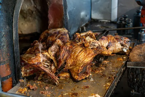 stock image Traditional Denizli kebab or Tandir Kebab in front of the wood oven