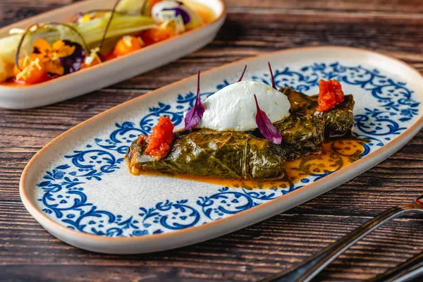 stock image Turkish Dolma (sarma) stuffed vine leaves from Turkish traditional cuisine. Turkish name Yaprak Sarmasi