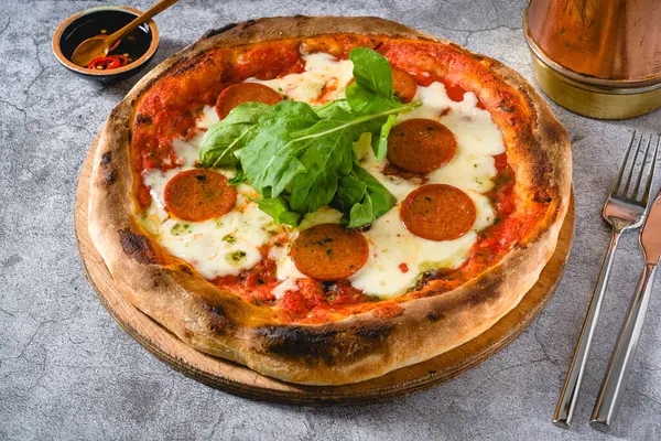 stock image Top view of Neapolitan pizza with sausage, jalapeno peppers and arugula