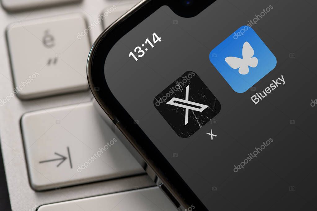 Antalya, Turkey - November 19, 2024: Bluesky Social and X ( Twitter ) app displayed on an iPhone screen